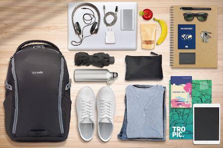 must have travel essentials, carry on backpack, portable power bank, noise canceling headphones, reusable water bottle, laptop sleeve
